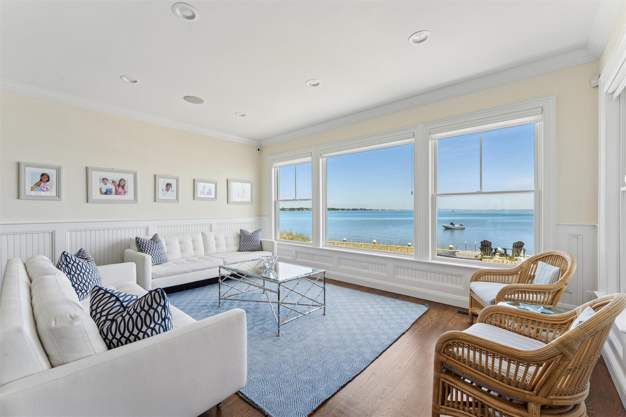 9 Shinnecock Road East Quogue, NY 11942 - Photo 5 of 34 a living room with furniture and a large window