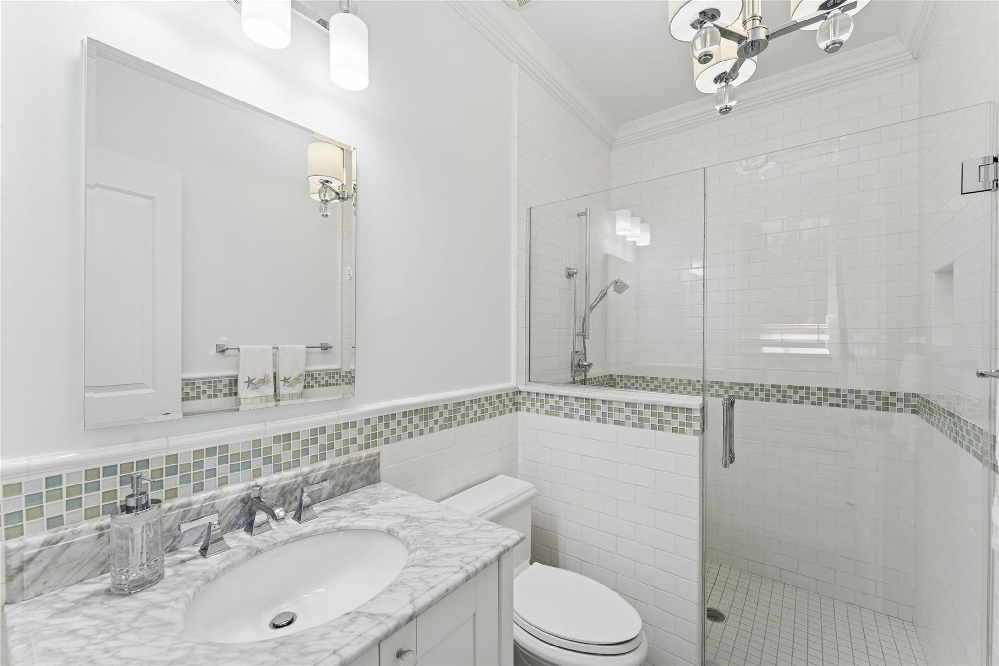 9 Shinnecock Road East Quogue, NY 11942 - Photo 10 of 34 a bathroom with a granite countertop sink mirror vanity and toilet