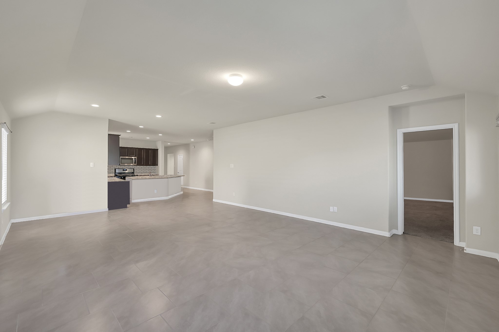 3310 Scout Island Katy, TX 77494 - Photo 12 of 42 a view of empty room with kitchen