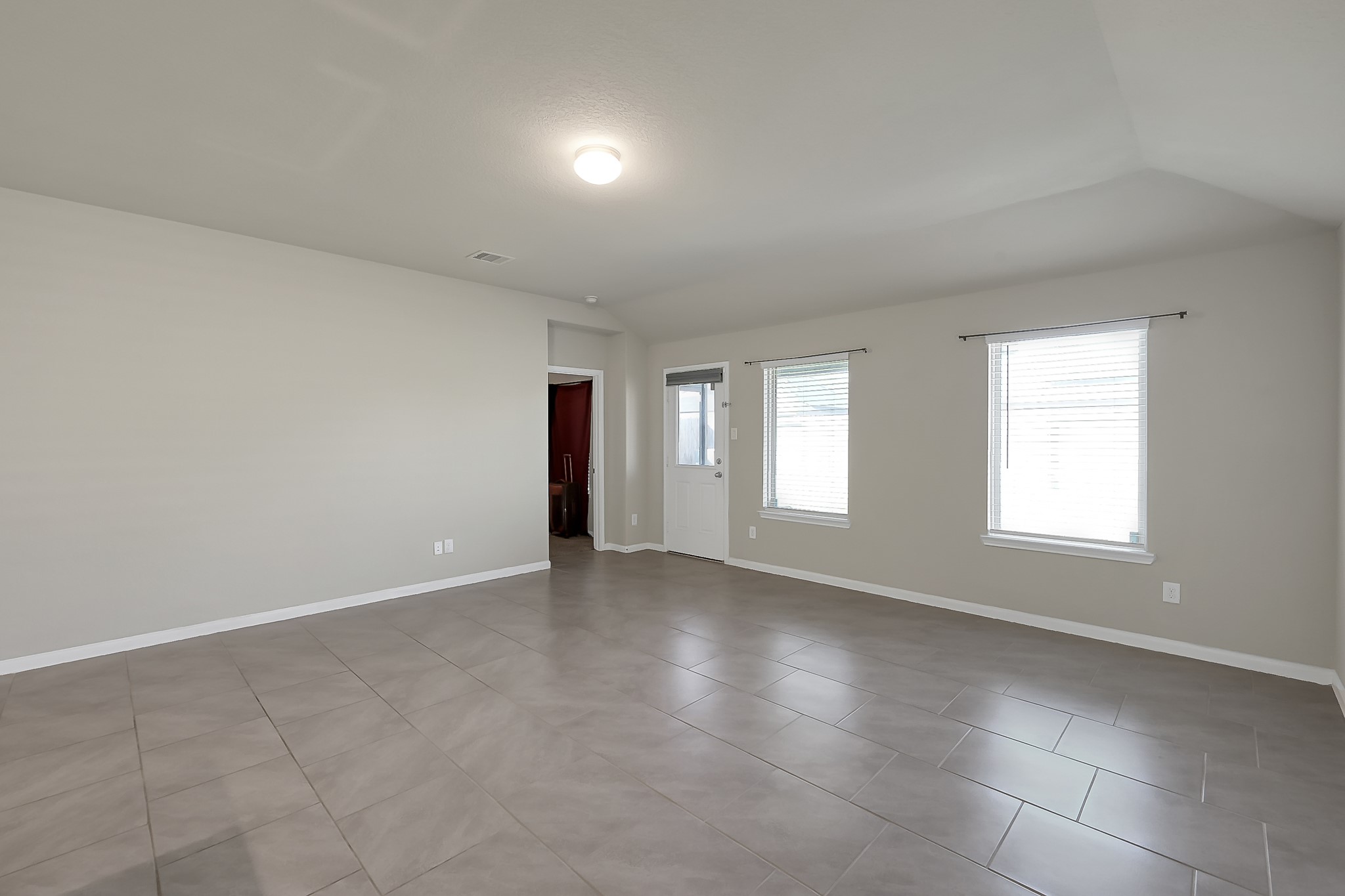 3310 Scout Island Katy, TX 77494 - Photo 15 of 42 an empty room with windows and entrance