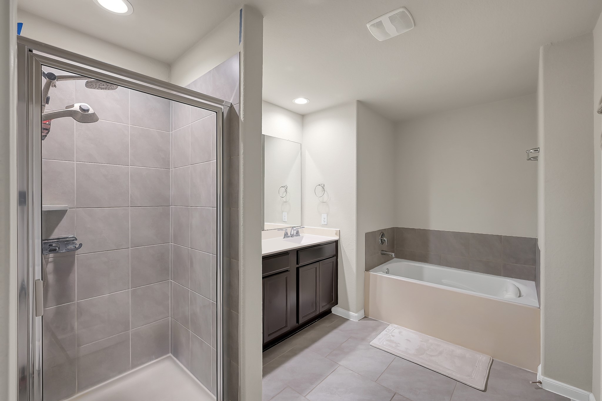 3310 Scout Island Katy, TX 77494 - Photo 20 of 42 a bathroom with a bathtub and a shower