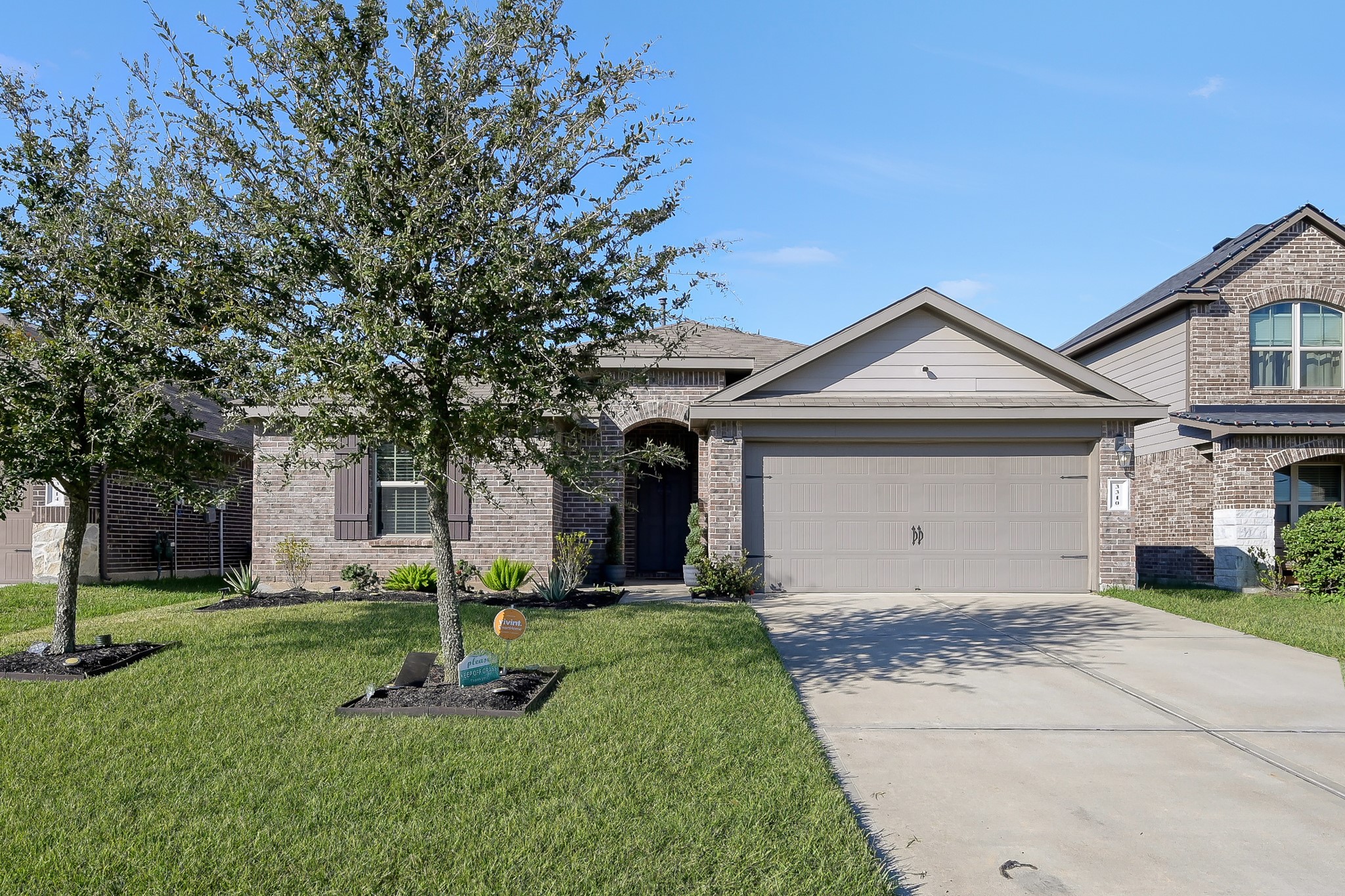 3310 Scout Island Katy, TX 77494 - Photo 2 of 42 a front view of a house with a yard and trees