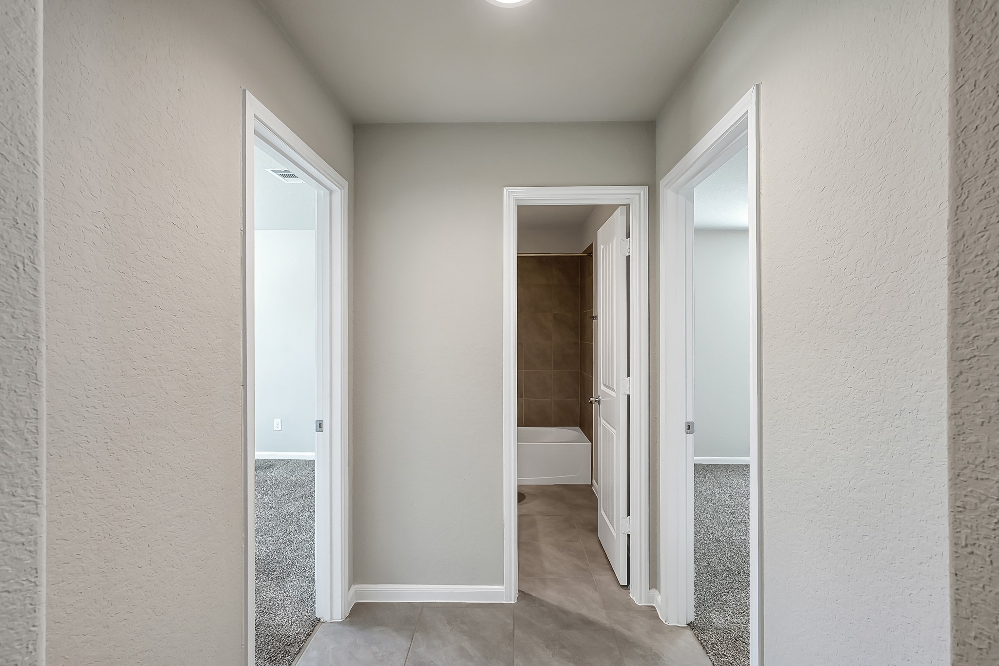 3310 Scout Island Katy, TX 77494 - Photo 24 of 42 a view of a hallway with toilet and door