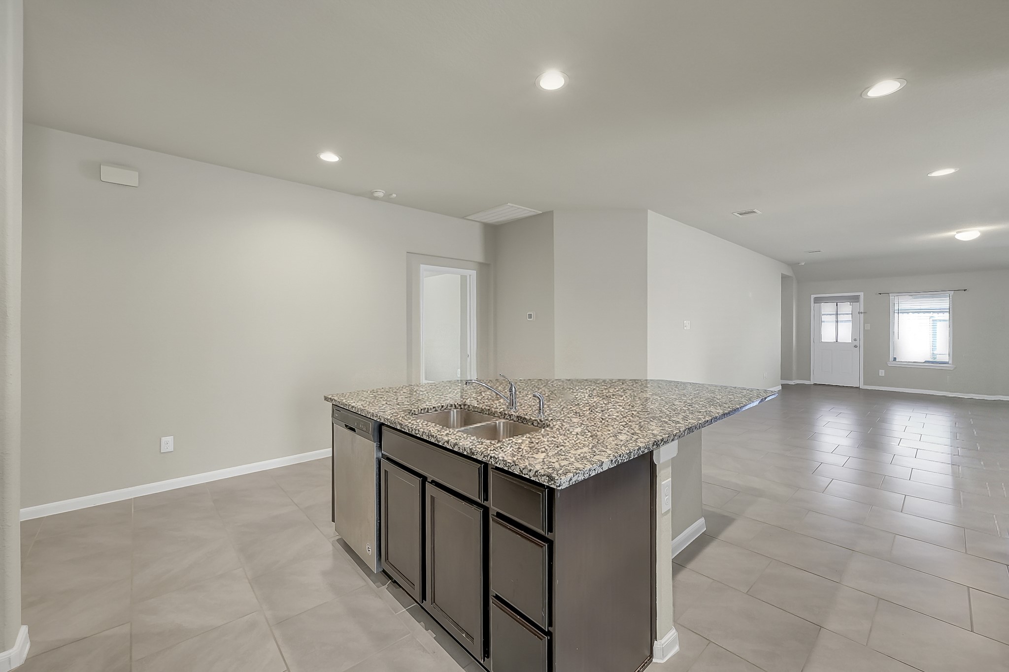 3310 Scout Island Katy, TX 77494 - Photo 9 of 42 a kitchen with stainless steel appliances granite countertop a sink and a white cabinets