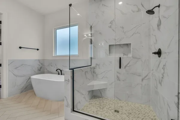 a close view of a sink a mirror and cabinets