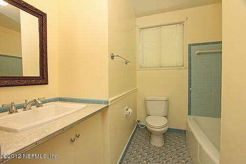 3045 Kline Road Jacksonville, FL 32246 - Photo 11 of 15 a bathroom with a sink a toilet and shower