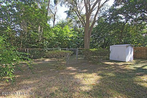 3045 Kline Road Jacksonville, FL 32246 - Photo 13 of 15 a backyard of a house with lots of green space