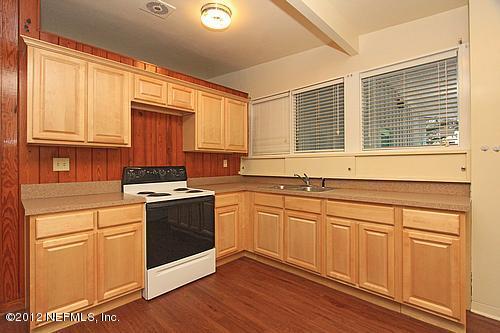 3045 Kline Road Jacksonville, FL 32246 - Photo 3 of 15 a kitchen with stainless steel appliances granite countertop a sink a stove and a refrigerator