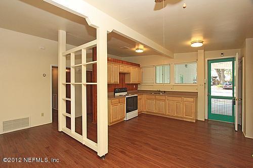 3045 Kline Road Jacksonville, FL 32246 - Photo 4 of 15 a kitchen with stainless steel appliances a refrigerator and a stove top oven