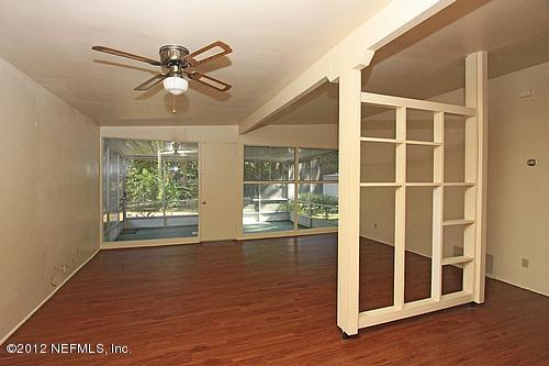 3045 Kline Road Jacksonville, FL 32246 - Photo 5 of 15 a view of a livingroom with a ceiling fan and window
