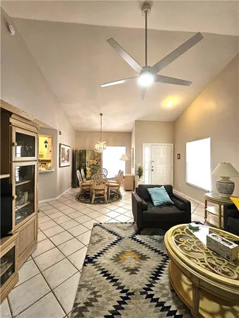 a living room with furniture a table and chairs