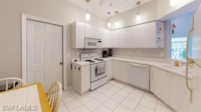 a kitchen with a sink cabinets and window