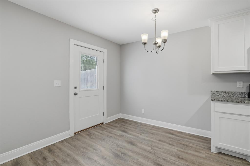 1022 West Shepherd Street, Unit 1022 Denison, TX 75020 - Photo 9 of 27 a view of an empty room with a window