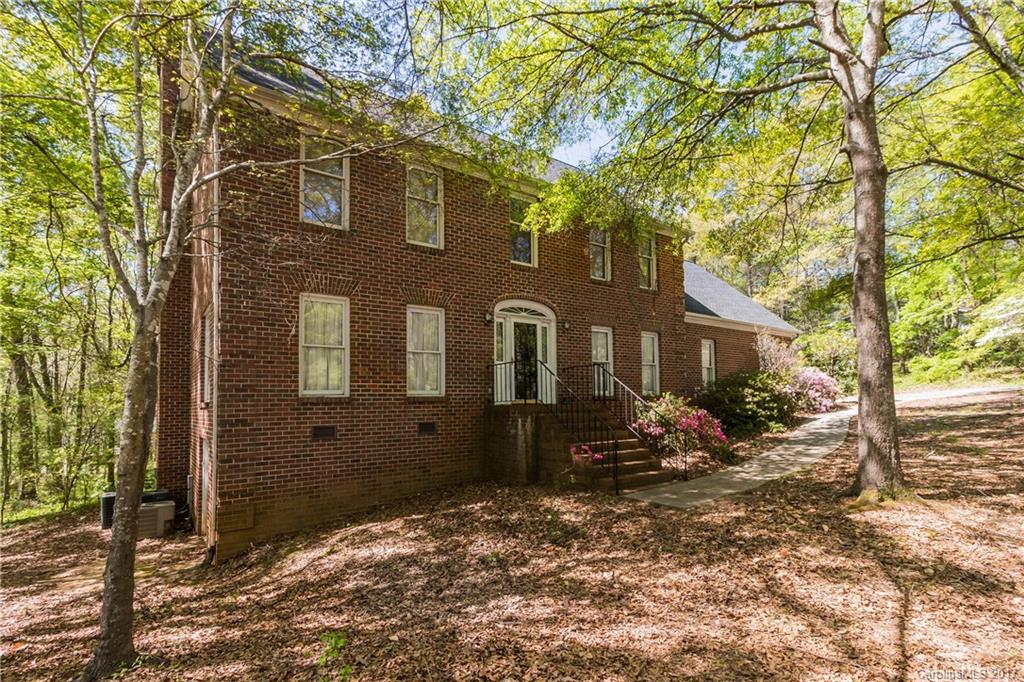 1697 Double Oaks Road Fort Mill, SC 29715 - Photo 1 of 24 a front view of a house with a yard