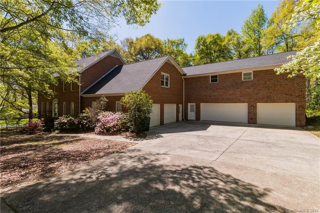 1697 Double Oaks Road Fort Mill, SC 29715 - Photo 2 of 24 a front view of a house with a yard and garage