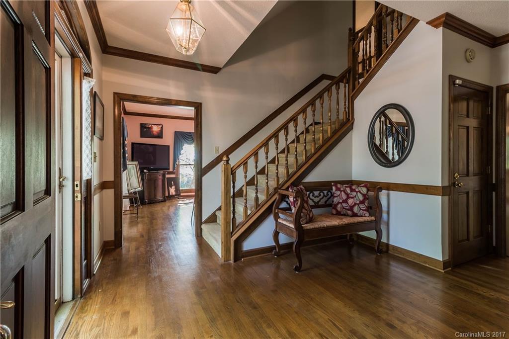 1697 Double Oaks Road Fort Mill, SC 29715 - Photo 13 of 24 a view of an entryway with wooden floor and a hallway