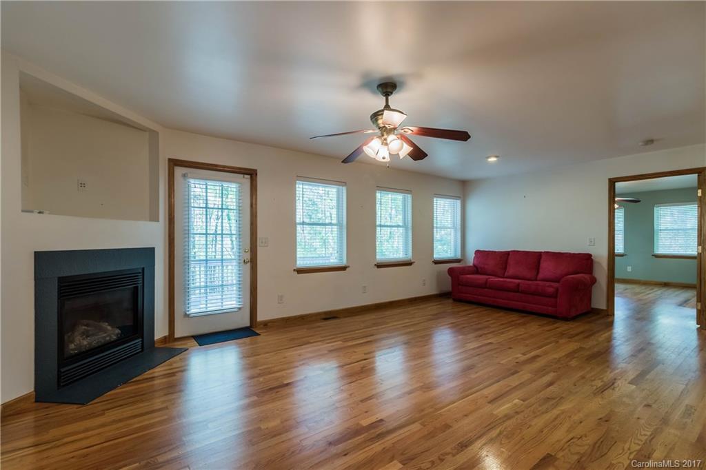 1697 Double Oaks Road Fort Mill, SC 29715 - Photo 19 of 24 a living room with furniture fireplace and window
