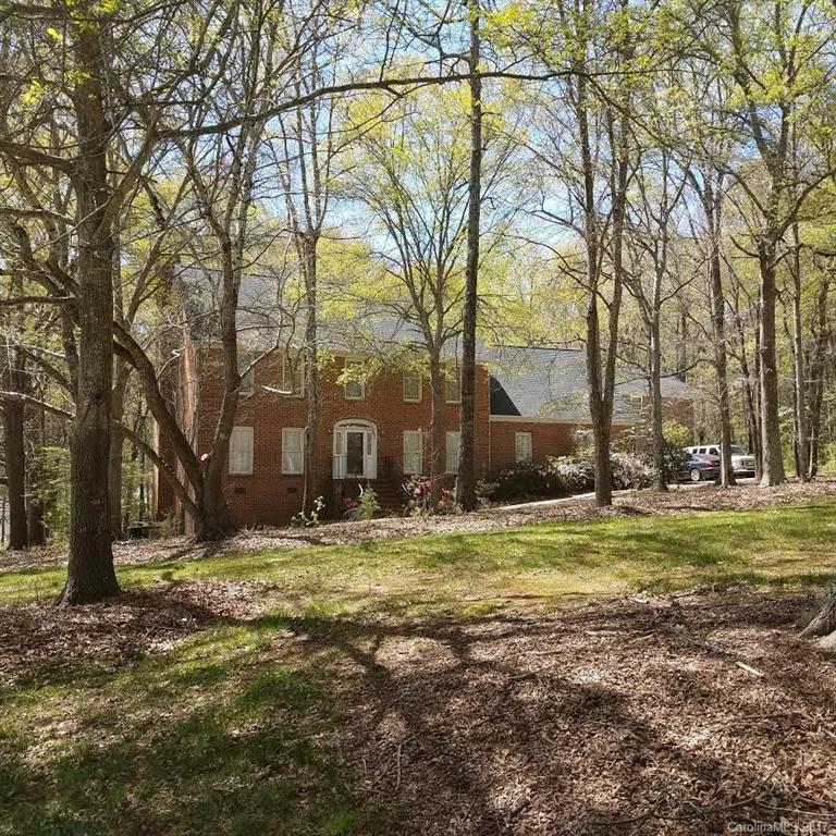 1697 Double Oaks Road Fort Mill, SC 29715 - Photo 24 of 24 a view of a backyard with large trees