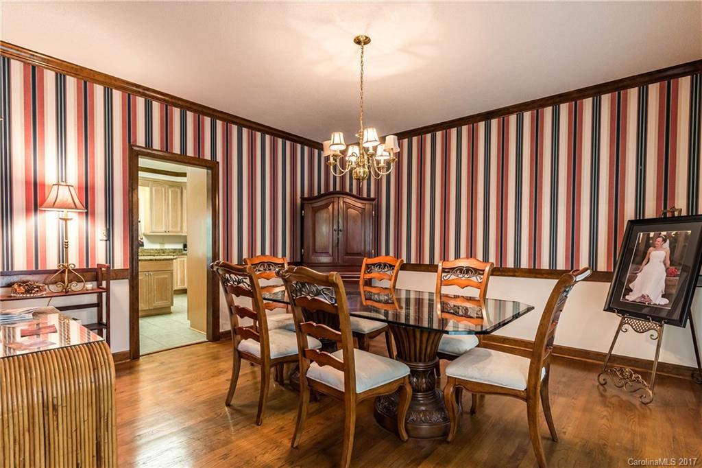 1697 Double Oaks Road Fort Mill, SC 29715 - Photo 6 of 24 a view of a dining room with furniture window and wooden floor