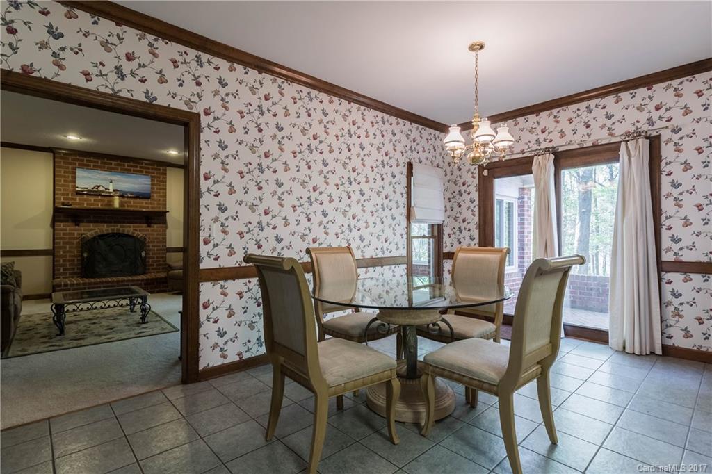 1697 Double Oaks Road Fort Mill, SC 29715 - Photo 8 of 24 a view of a dining room with furniture and chandelier