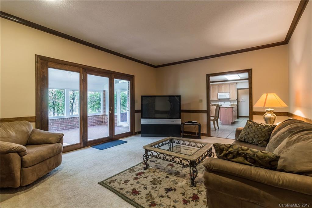 1697 Double Oaks Road Fort Mill, SC 29715 - Photo 9 of 24 a living room with furniture and a flat screen tv