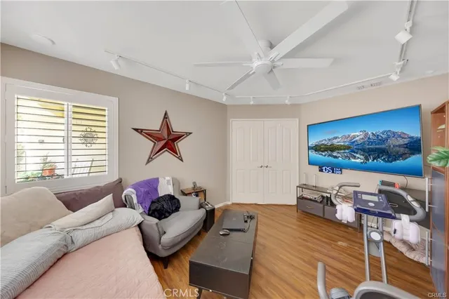 a room with furniture and flat screen tv