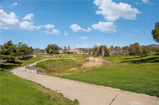 a view of a lake with houses in the back
