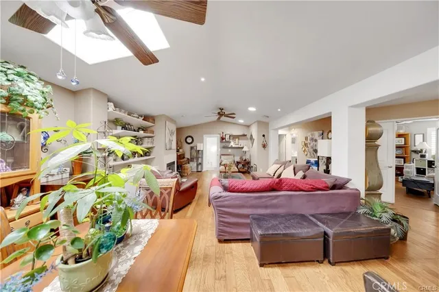 a living room with furniture fireplace and a chandelier