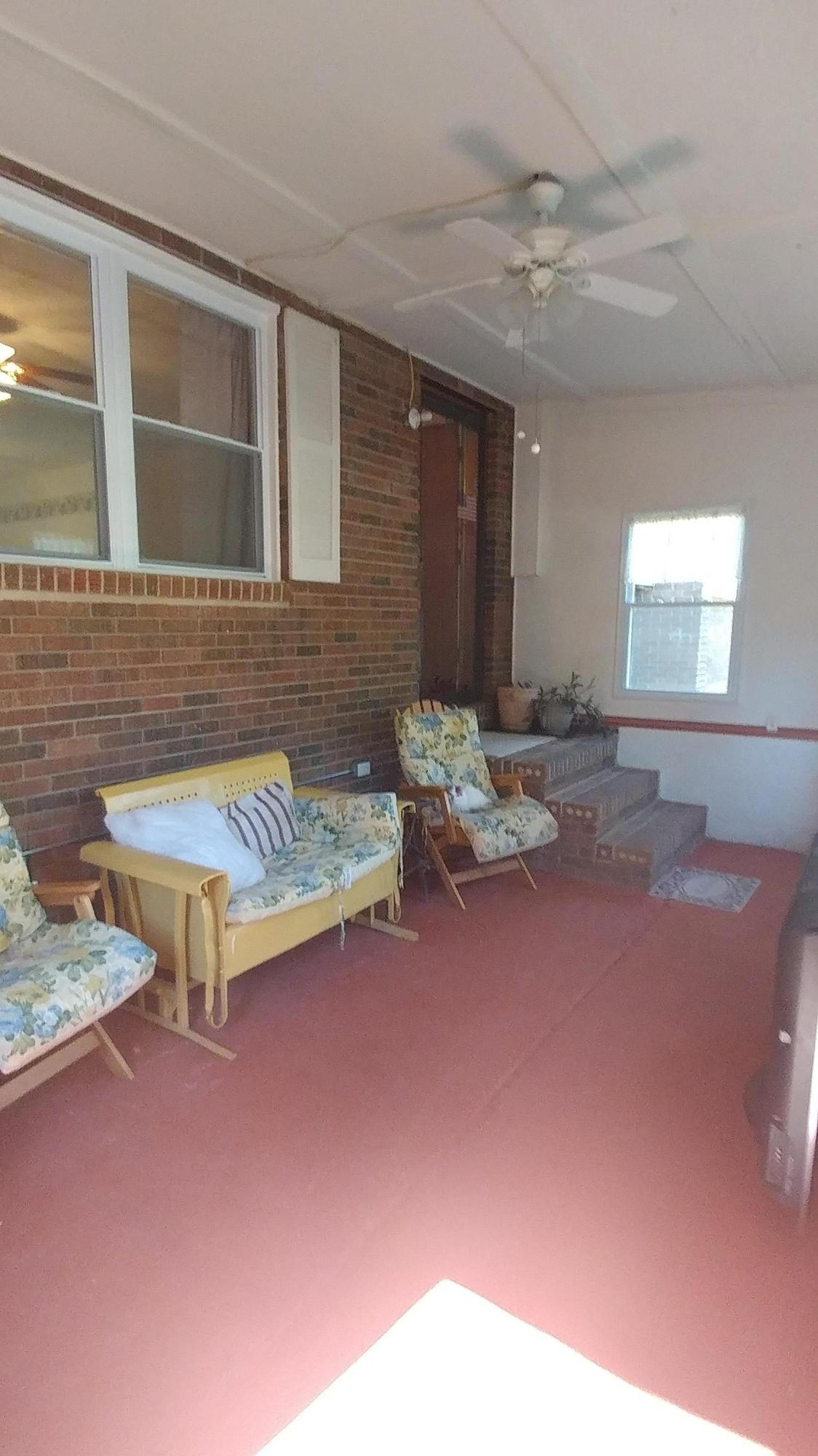 8269 Toestring Valley Road Spring City, TN 37381 - Photo 3 of 36 Front enclosed porch