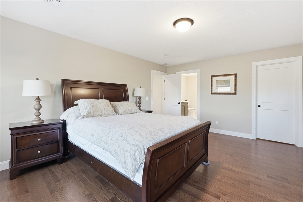 103 Rice Corner Road Brookfield, MA 01506 - Photo 21 of 39 a bedroom with a bed and a night stand