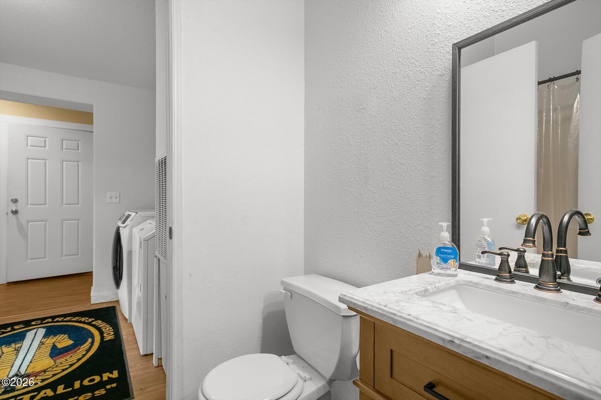 3909 North Bayview Road Waldport, OR 97394 - Photo 28 of 44 Hall Bathroom & Utility Room Main Level