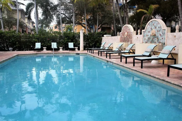 a view of swimming pool with outdoor seating