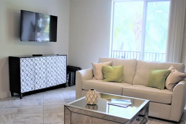 a living room with furniture and a window