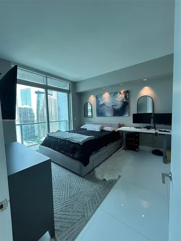 a kitchen with a sink and a stove top oven