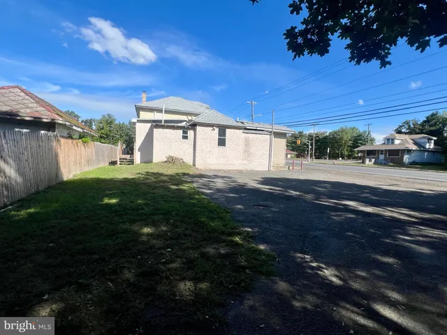 a big yard with palm trees