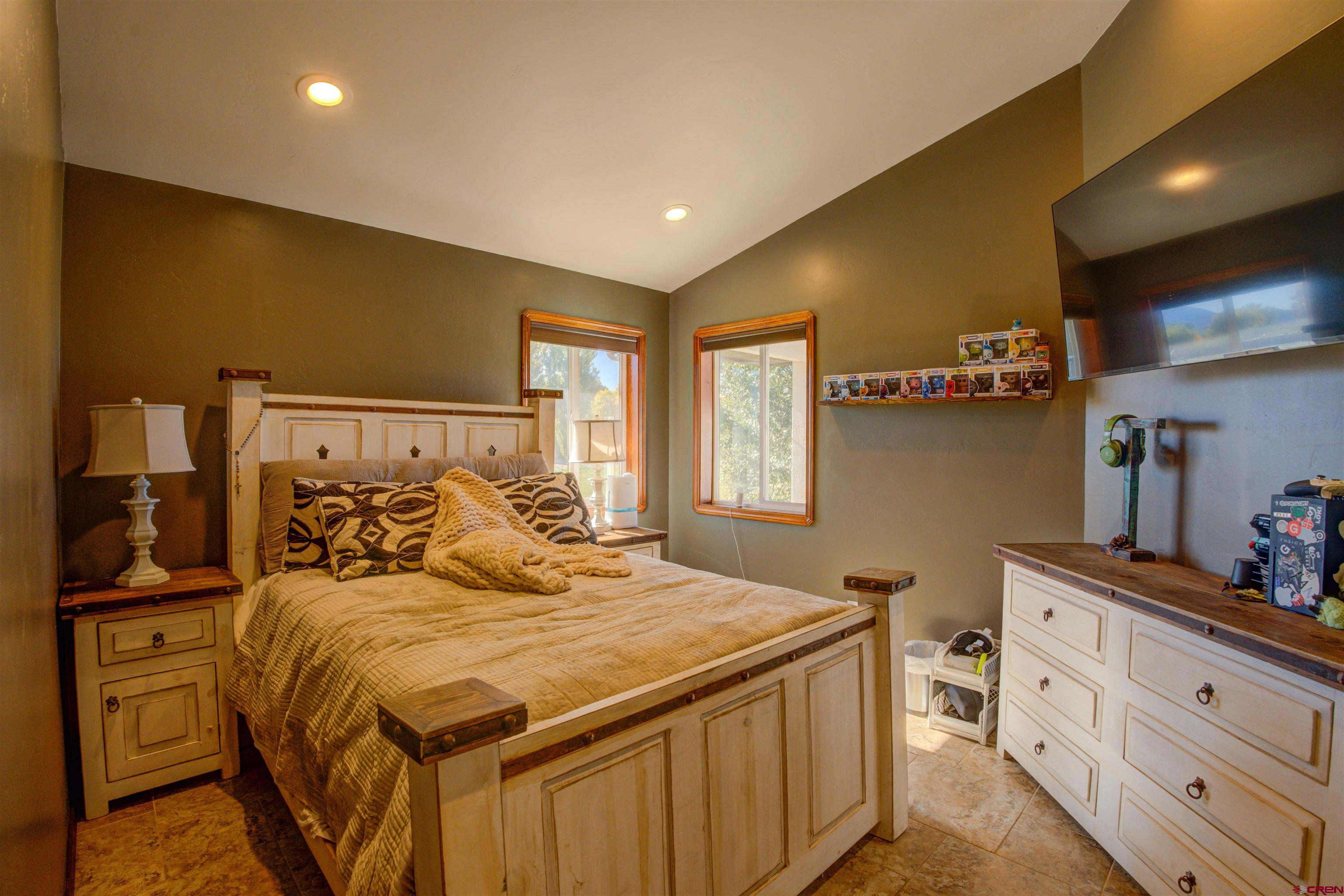 12336 Road 23.25 Loop Cortez, CO 81321 - Photo 23 of 43 a bedroom with a bed and with furniture