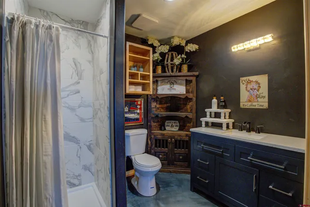 a kitchen that has a sink and a stove in it