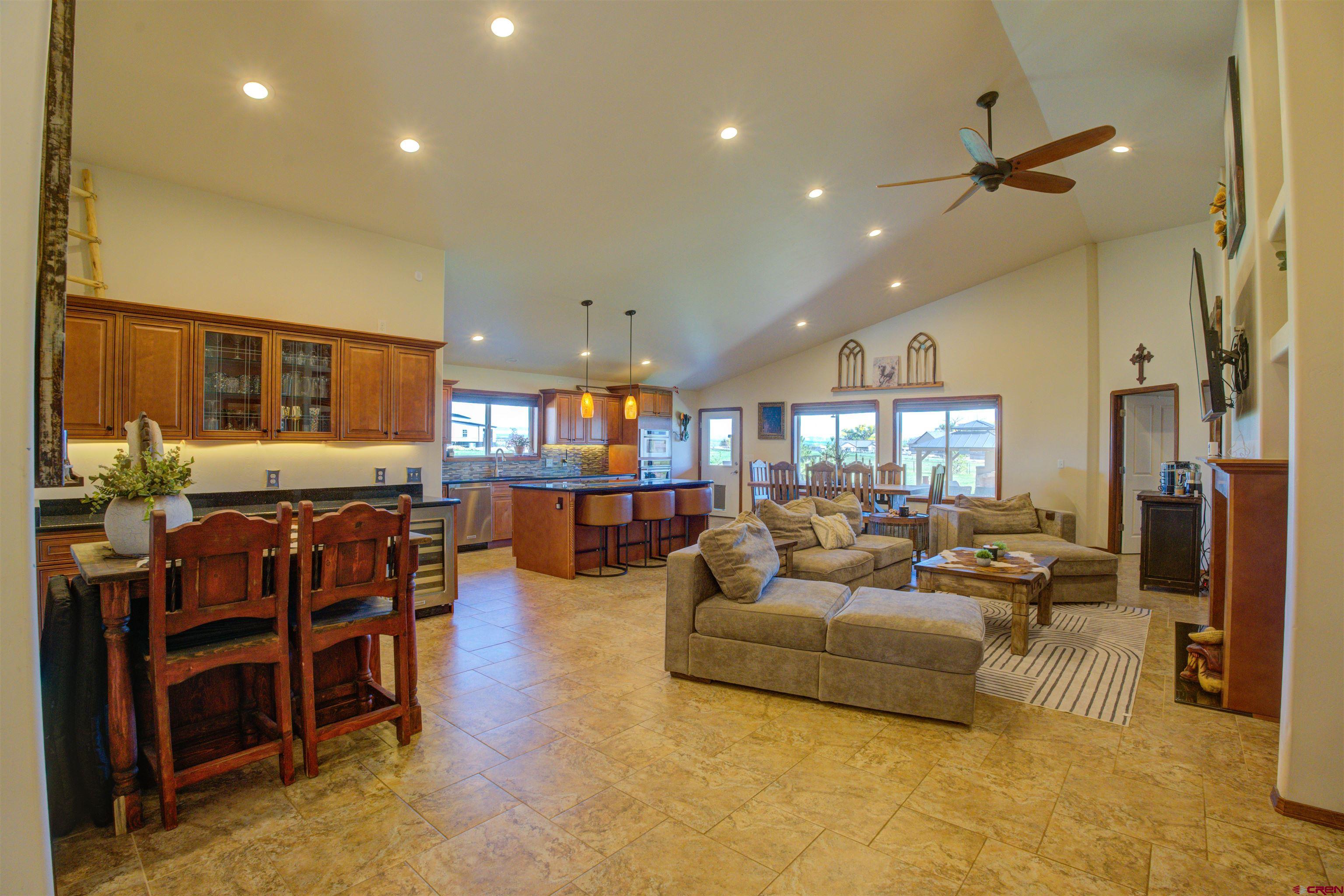 12336 Road 23.25 Loop Cortez, CO 81321 - Photo 6 of 43 a living room with furniture kitchen view and a large window