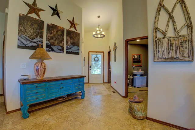 a bedroom with furniture and wooden floor