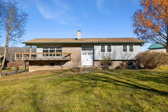 a front view of a house with swimming pool