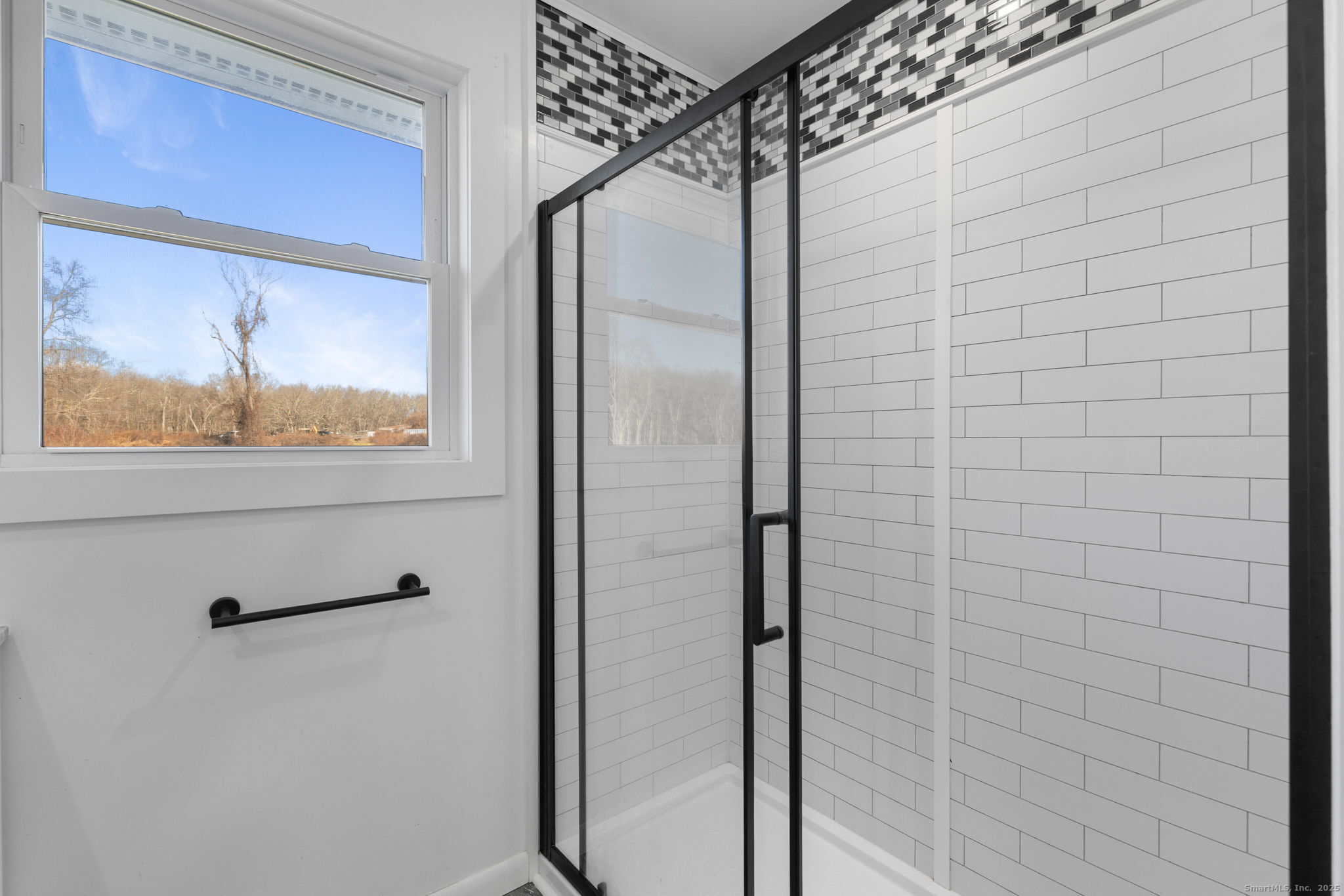 475 Parum Road Colchester, CT 06415 - Photo 15 of 28 a bathroom with a glass shower door and a window