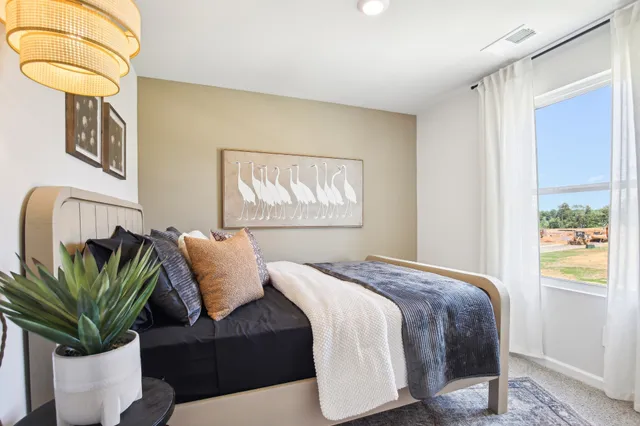 a bedroom with a balcony and a bed