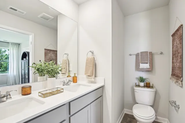 a view of a house with a yard and a patio