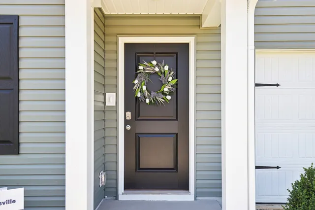 a view of living room kitchen and entryway