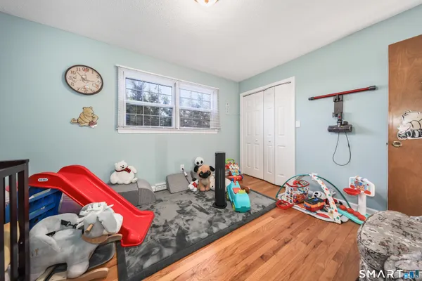 a bedroom with bed and a window
