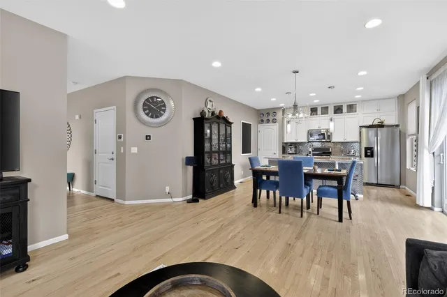 a view of kitchen dining table and a refrigerator