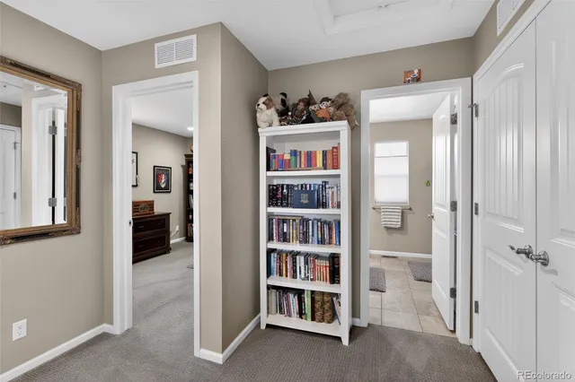 a view of a bedroom with a furniture and closet