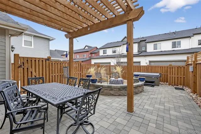 a view of a dinning table and chairs in the patio