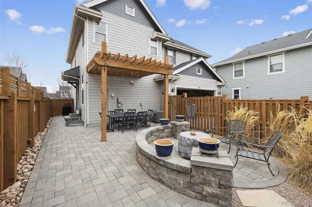 a swimming pool with outdoor seating and yard