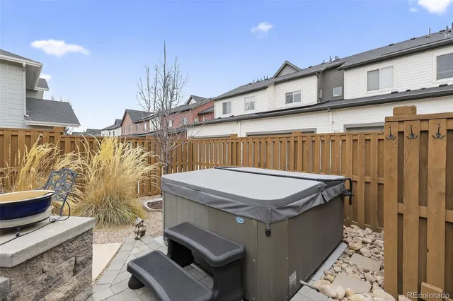 a dinning table and chairs in front of a house